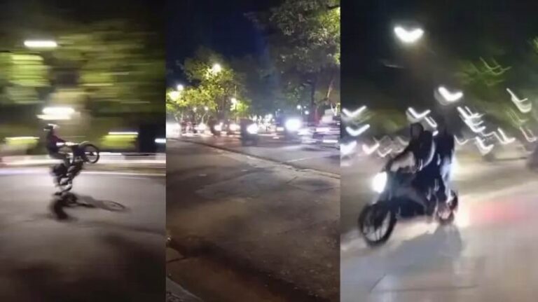 Moto realizando una maniobra de stunt en una avenida de Corrientes